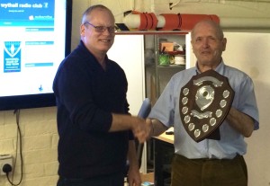 Chairman Mike G4VPD receives the trophy from Martyn G3UKV